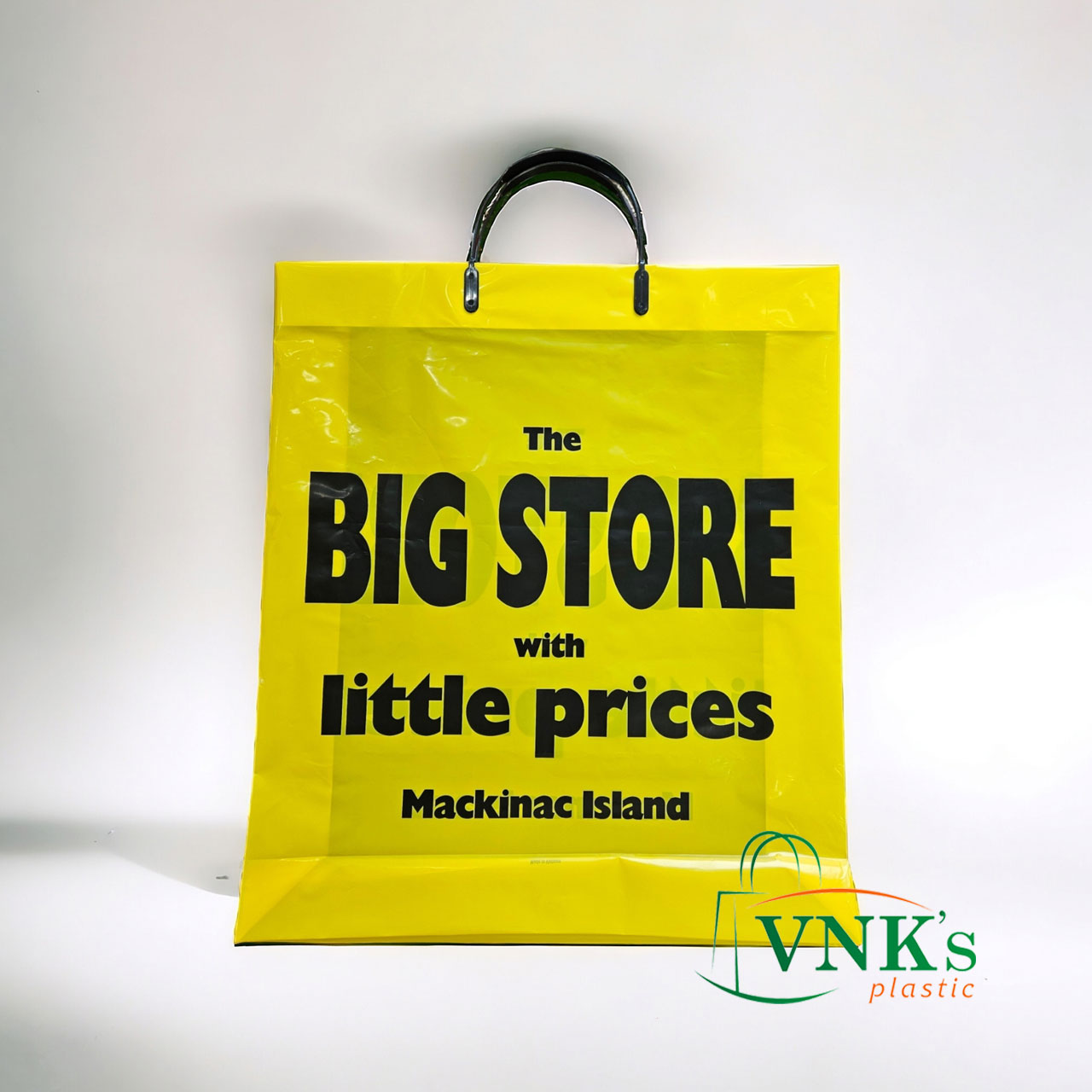 Shopping bag with rigid handle